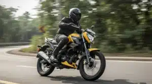 TVS Raider 125 with ABS and rear disc brake, displayed on a city street during sunset with promotional overlay text.